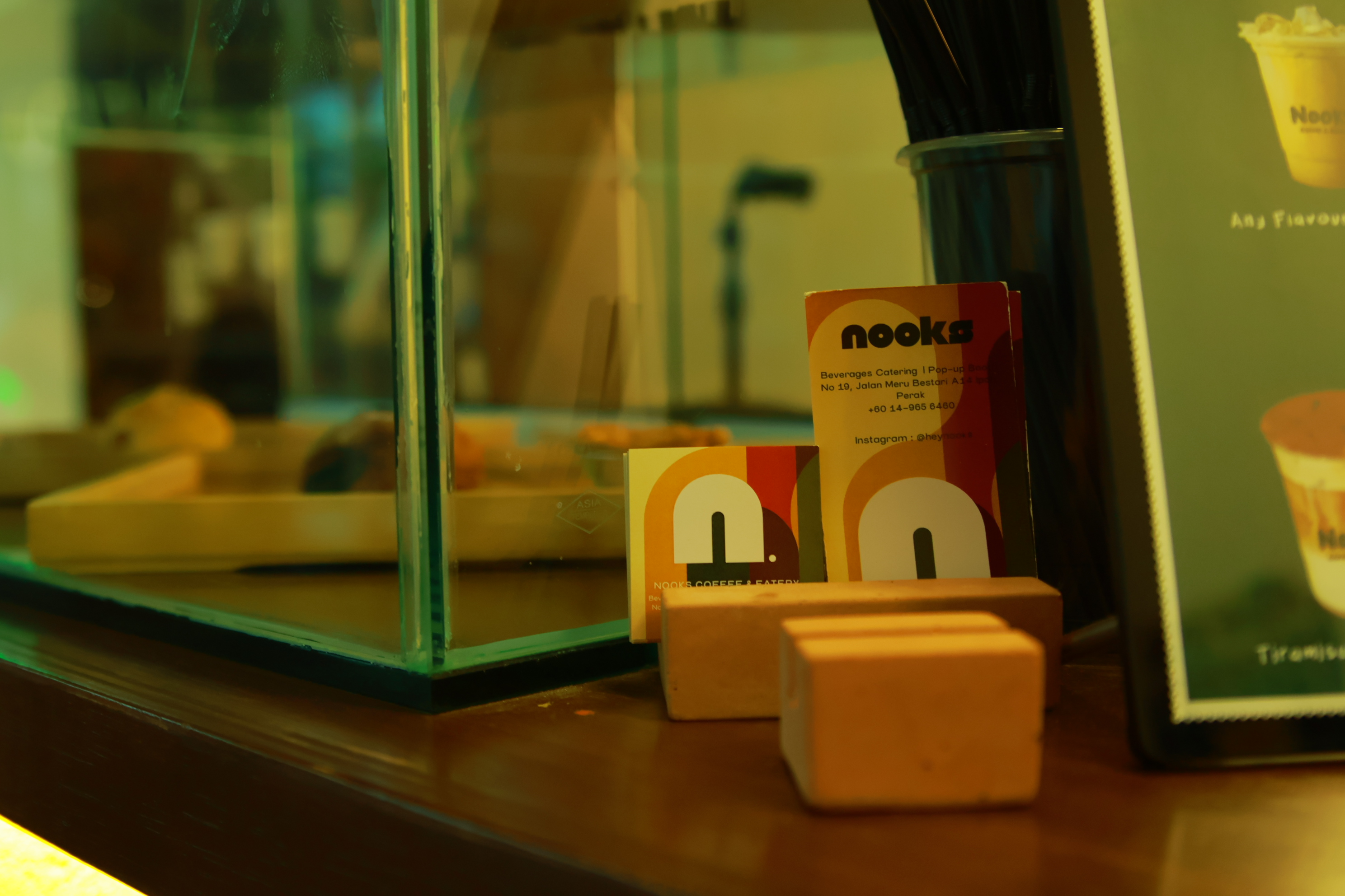 NOOKS business cards on the counter