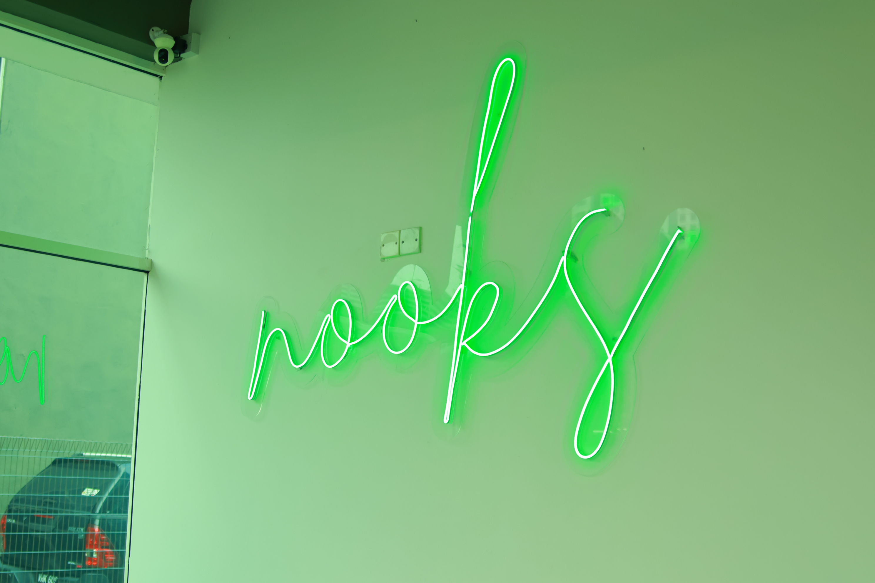 NOOKS neon sign on the wall