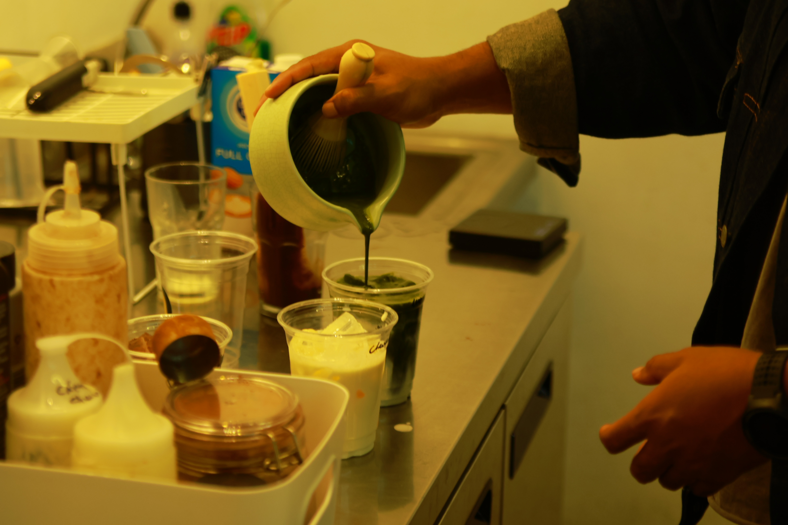 Pouring syrup into a drink