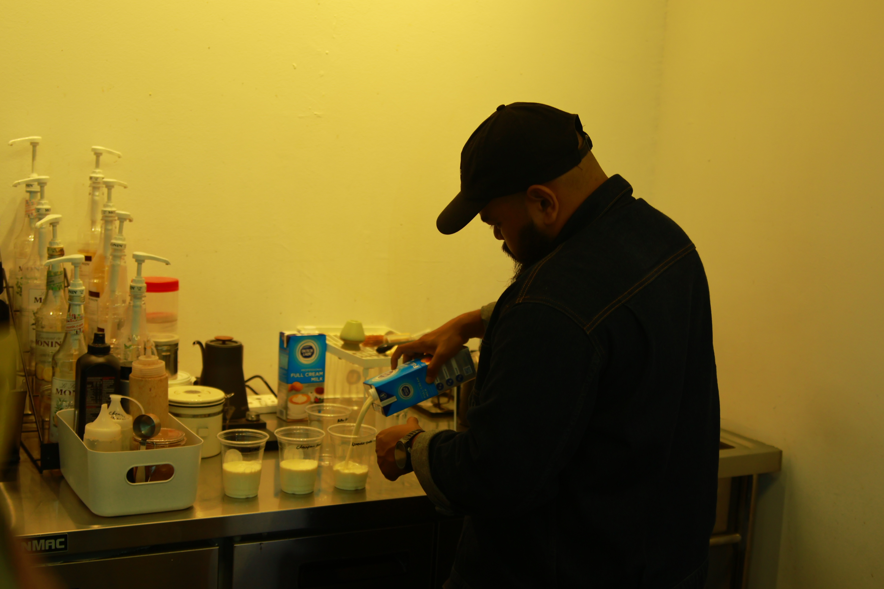 Preparing drinks behind the counter