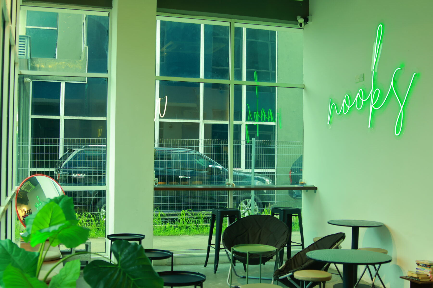 NOOKS window seating area with plants and soft afternoon light