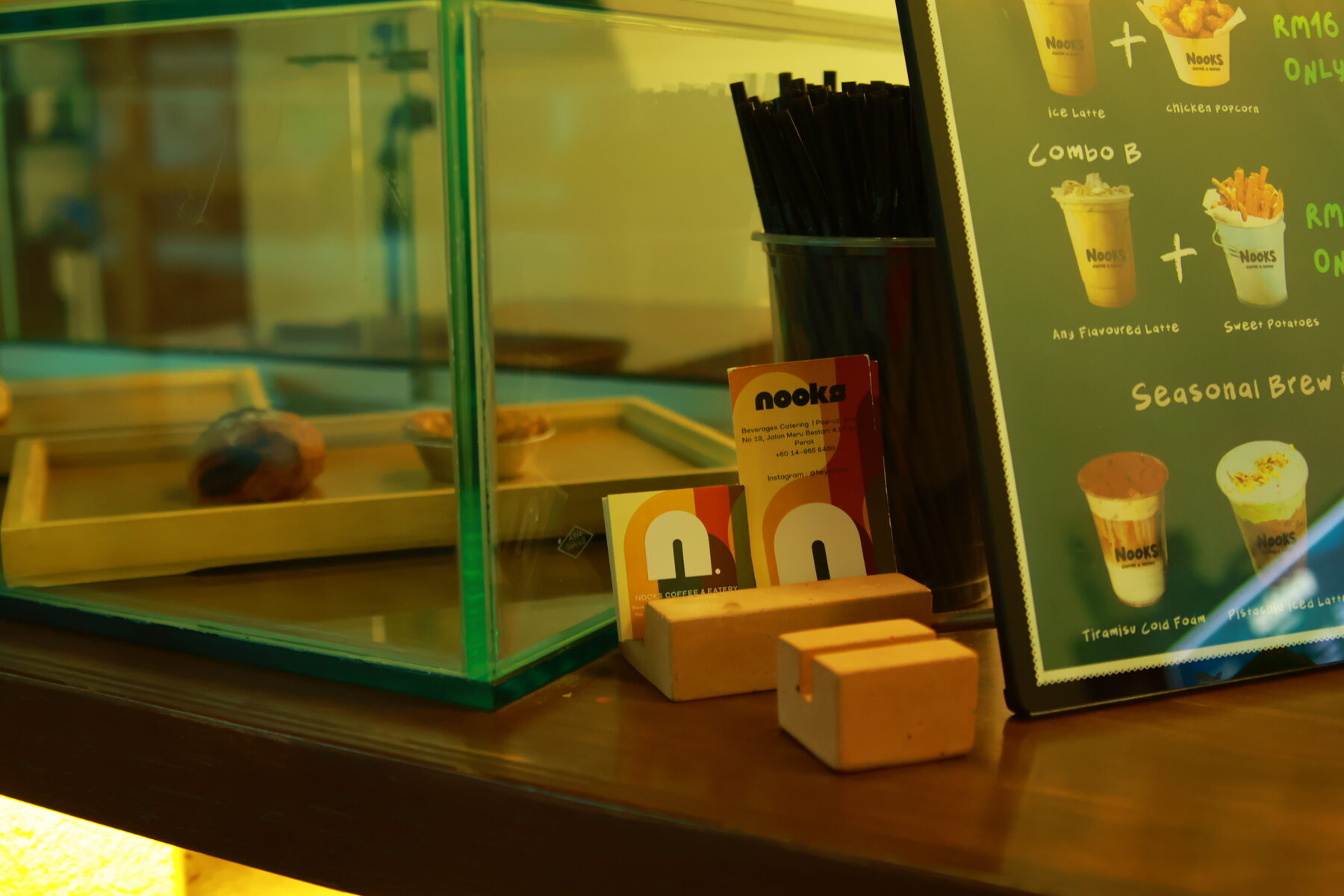 Pastry and cake display case at NOOKS